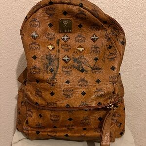 MCM Stark Visetos studded backpack in cognac color